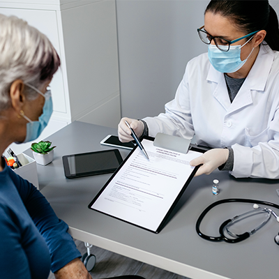 doctor showing patient clip board