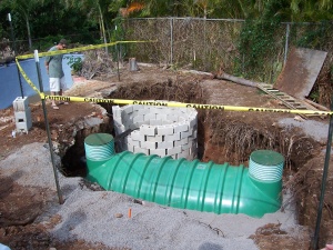 Photo showing a septic tank and a seepage pit.