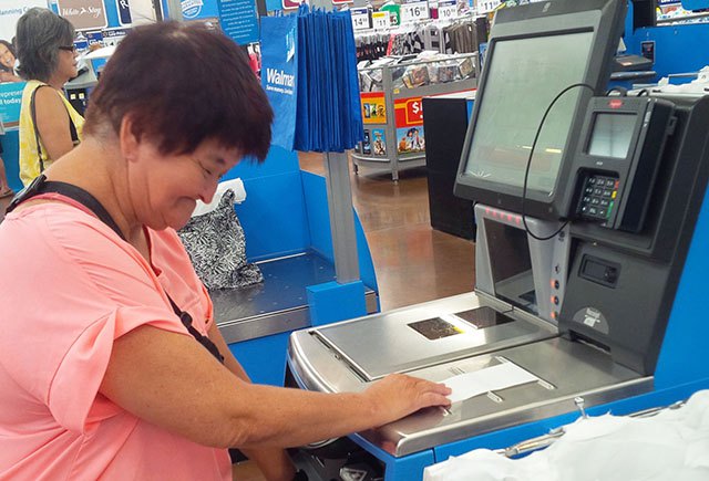 Photo: DDD Participant at Self Checkout Register
