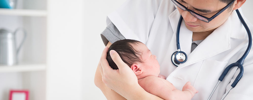 Photo: Doctor with a baby