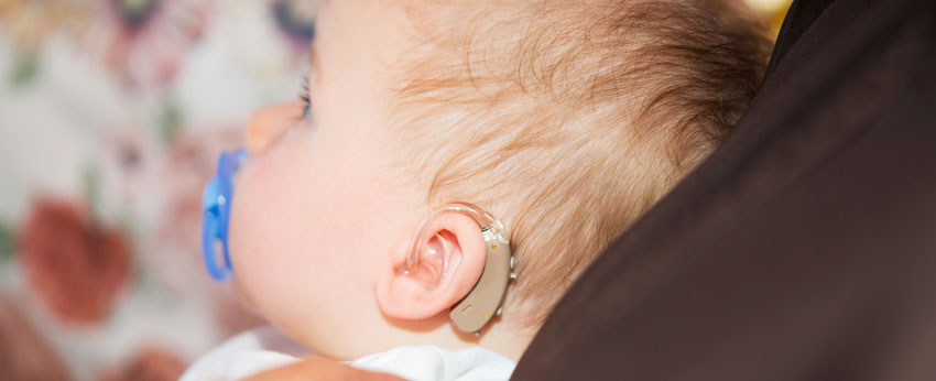 Photo: Baby with a hearing aid
