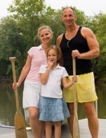 Family holding paddles