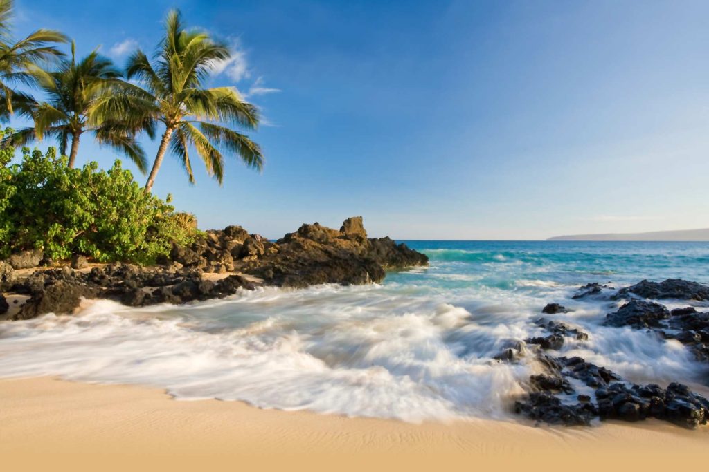 photo of Makapuu beach with mountains in background
