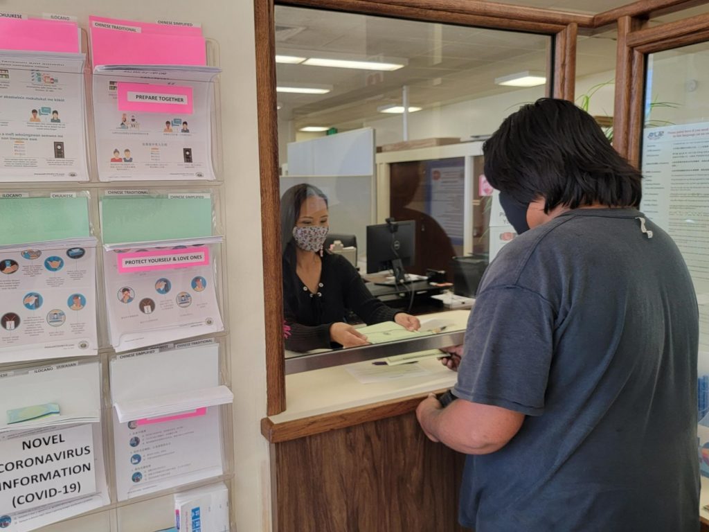 Kauaʻi District Health Office employee Pamela-Lani Yamaguchi issues the first vital record printed and embossed on Kauaʻi to Lihue resident Chaunci Nakaula (February 2022)