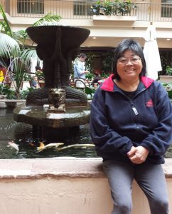 Photo: Val sitting by a fountain